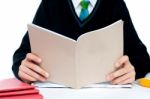 Schoolboy Holding Book Stock Photo