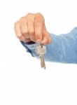 Male Hand Holding Key On White Stock Photo