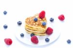 Pile Of Heart Shaped Pancakes With Blueberries And Raspberries Stock Photo