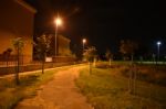 Night Public Park In The City With Houses Near Stock Photo