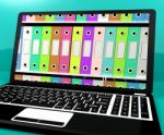 Colorful Files With Laptop Stock Photo