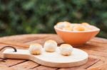 Mini Chinese Cakes On Wooden Plate Stock Photo