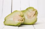 Chayote Fruit On White Wood Background Stock Photo