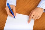 Female Hand Signing Contract Stock Photo