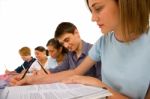 Teenage students Writing On book Stock Photo