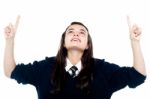 Schoolgirl Showing Pointing Upwards Stock Photo