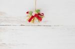 Christmas Bells On Wooden Floor Background  Stock Photo