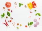 The Ingredients For Homemade Pizza On White Wooden Background Stock Photo