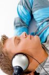 Young Guy Listening To Music With Headphones Stock Photo