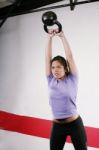 Lady Exercising With Kettlebell Stock Photo