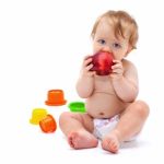 Cute Infant Boy With Apple Stock Photo