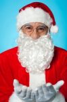 Smiling Aged Santa Posing With Open Palms Stock Photo