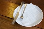 Fork And Knife With White Plate Stock Photo