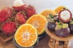 Thai Tropical Fruit On Wooden Table Stock Photo