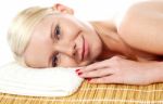 Spa Woman Relaxing In Bamboo Mat Stock Photo