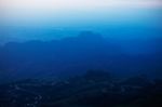 Mountain With Fog On The Sky Stock Photo