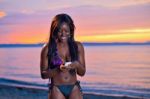 Beautiful Black African American Woman Posing On The Beach At Su Stock Photo