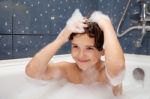 Little Girl Washes Her Head Stock Photo