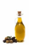 Green And Black Olives With Olive Oil Bottle Stock Photo