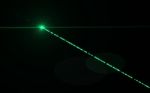 Digital Green Lens Flare In Black Background Stock Photo