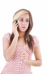 Shocked Woman Talking On Phone Stock Photo