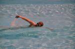 Female Swimming The Crawl Stock Photo