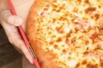 Delicious Pizza Pan With Cheese Crust Stock Photo