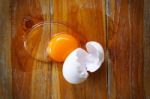 Broken Egg On Wooden Table Background Stock Photo