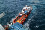 Supply Boat Transfer Cargo To Oil And Gas Industry Stock Photo