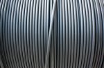 Close-up Of Black Electricity Cable Verticla On A Spool Stock Photo