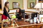 Pretty Professional Women  At Work Desk Stock Photo