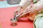 Buddhist's Grail Pouring Water Stock Photo