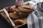 Dark Multigrain Bread Whole Grain And Jam Fresh Baked On Rustic Closeup Stock Photo