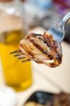 Grilled Onion On A Fork Stock Photo