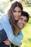 Outdoor Portrait Of Young Caucasian Couple At The Park Stock Photo