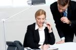 Woman Discussing Problem With Male Colleague Stock Photo