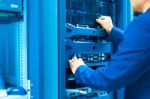 Man Fix Server Network In Data Center Room Stock Photo