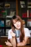 Portrait Of Thai Adult Student University Uniform Beautiful Drinking Coffee Stock Photo