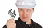 Handyman Wearing Uniform And Hardhat Stock Photo