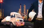 Engineer Holding Hard Hat Standing Against Beautiful Lighting Of Stock Photo