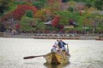 Japanese Boatman Sail Boat To Enjoy Autumn Leave Stock Photo