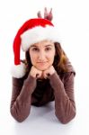 Lying Female Wearing Santa Hat Stock Photo