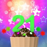 Twenty One Candle On Cupcake Means Colourful Celebration And Hap Stock Photo