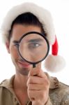 Guy Looking Through Magnifying Lens Stock Photo