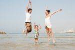 Family  In The Beach Stock Photo