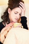 Woman Holding Her Head In Pain Stock Photo