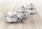 Silver Deluxe Cosmetic Jar On Wood Background Stock Photo