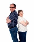 Senior Couple With Arms Crossed Stock Photo