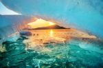 Very Large And Beautiful Chunk Of Ice At Sunrise In Winter Stock Photo