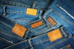 Jeans With Brown Leather Labels Background Stock Photo